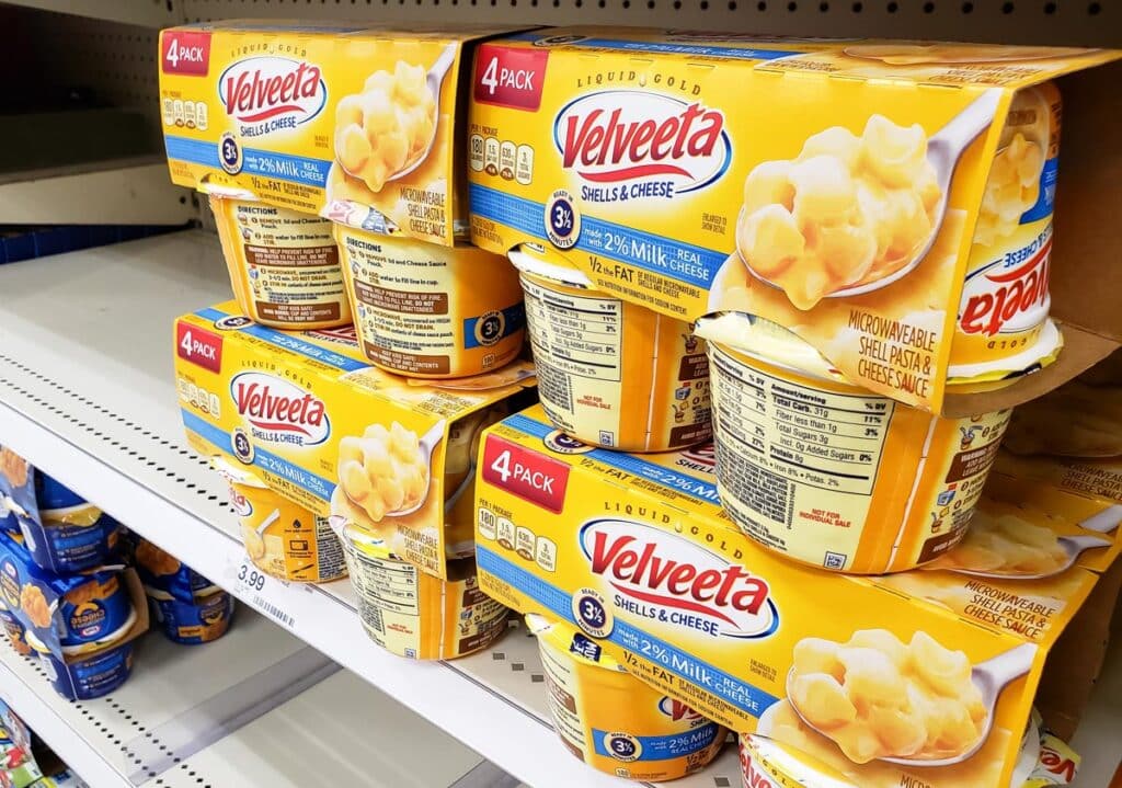 A view of several packages of Velveeta Shells and Cheese products, on display at a local grocery store.