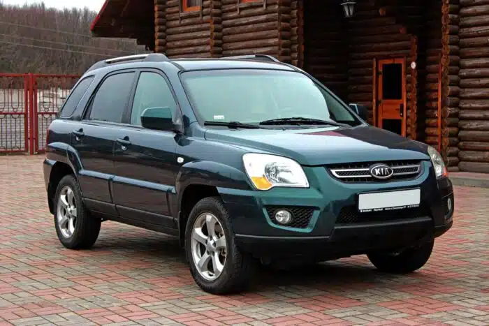 A 2009 green Kia Sportage.