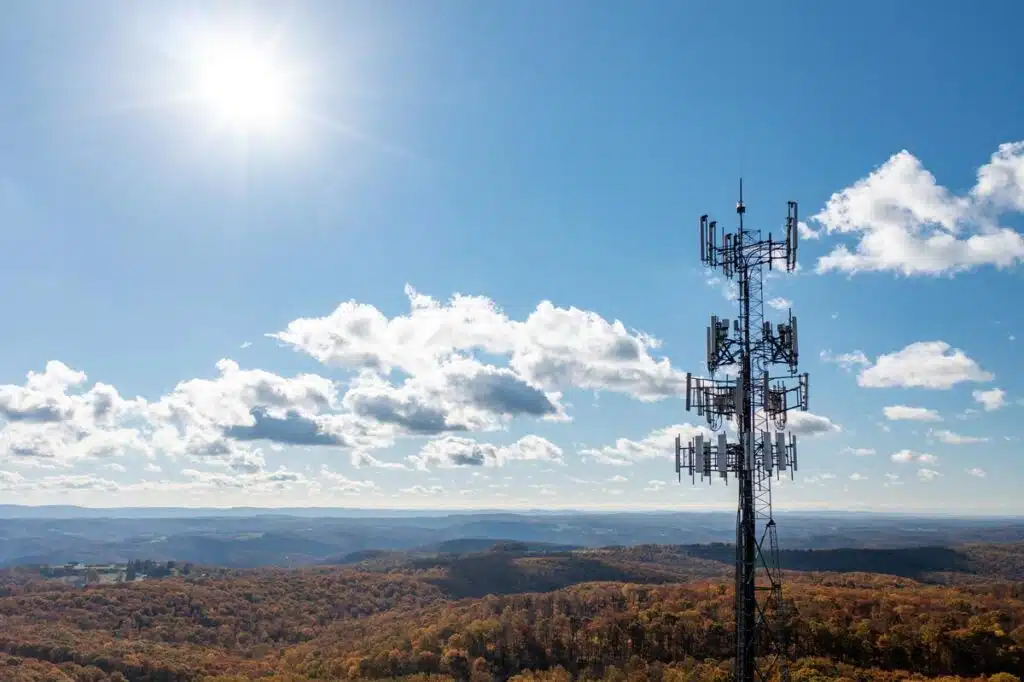 Broadband tower against a bright blue sky, representing the RCN Telecom settlement - rcn class action lawsuit