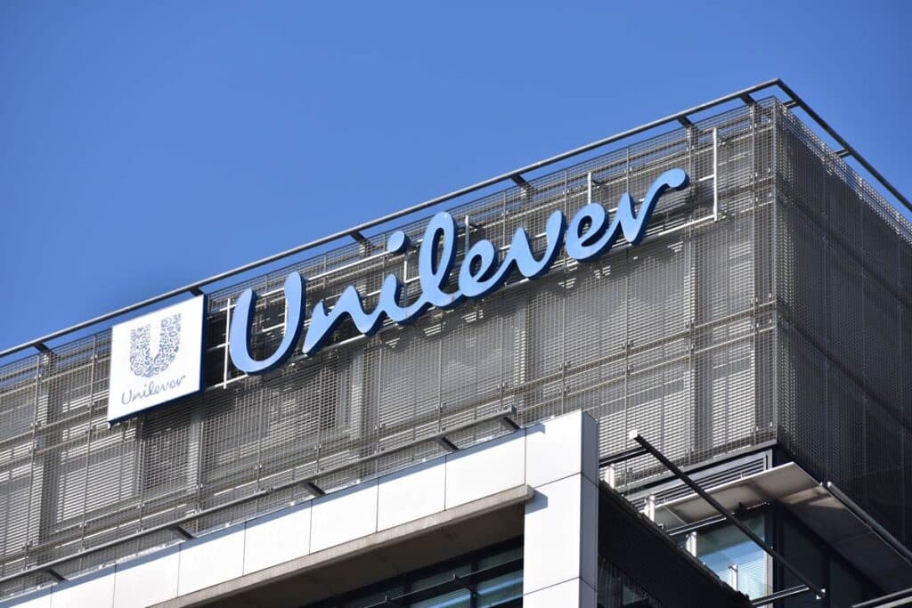 Close up of Unilever signage against a blue sky.