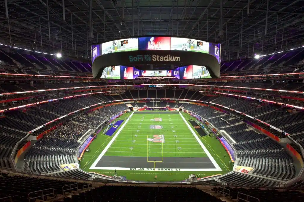 Interior of SoFi stadium with a display of the football field end zone.