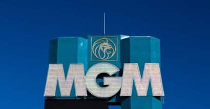Close up of MGM signage against a dark blue sky.