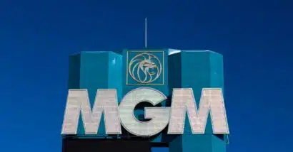 Close up of MGM signage against a dark blue sky.