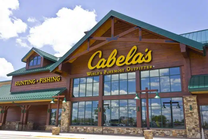 Exterior of a Cabelas store against a blue sky.