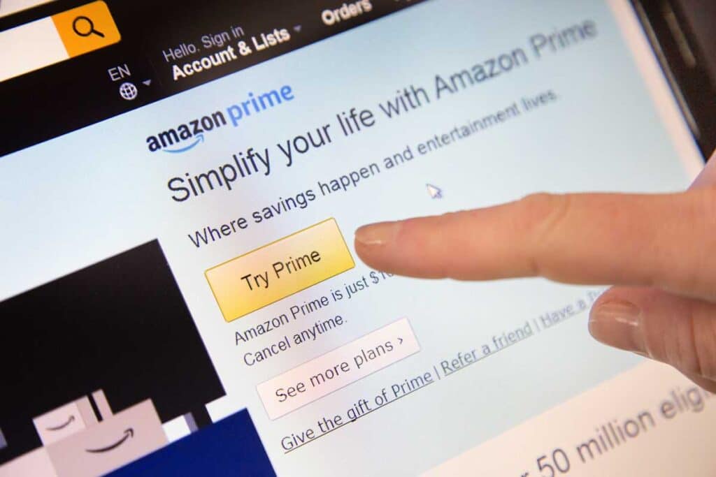 Amazon Sign in page of Website with a finger touching the screen, representing the Amazon Prime class action lawsuit.