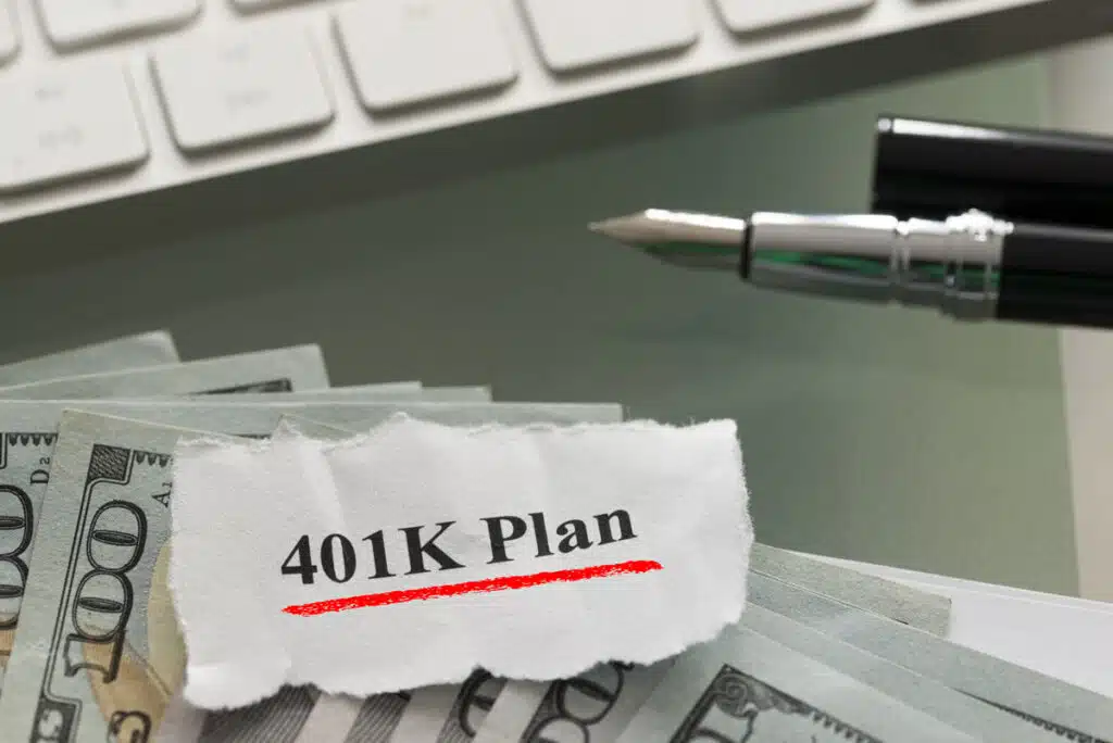 Close up of 401K note on top of money, representing the Coriant ERISA settlement.