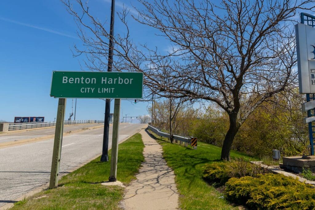 Benton Harbor signage next to a road, representing the water contamination class action lawsuit.