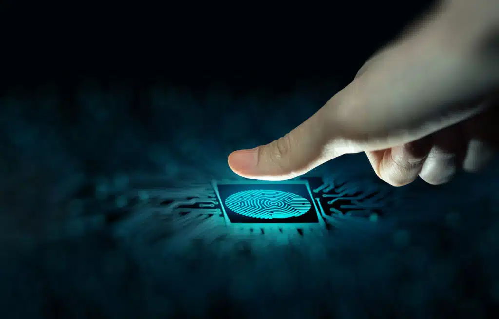 Close up of a thumb pressing on a fingerprint scanner, representing the Native Wholesale settlement.