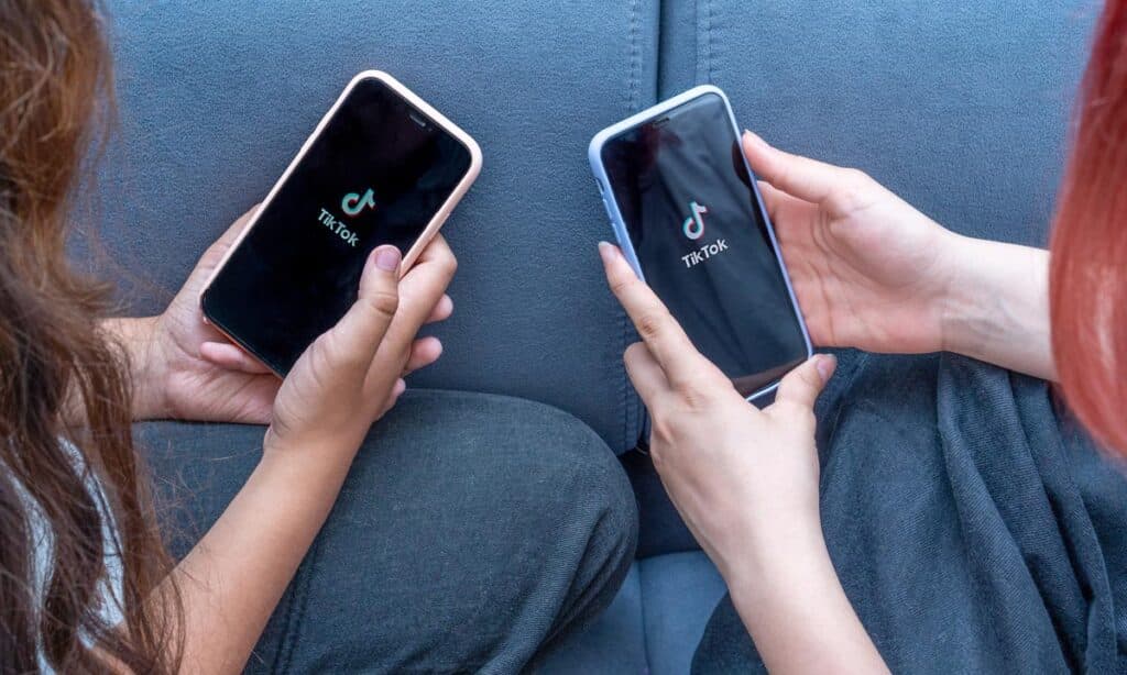 Close up of two girls using the Tik Tok app - TikTok data
