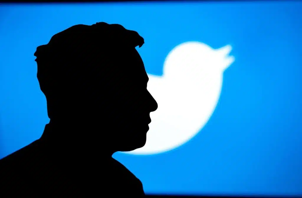 Portrait of business magnate and investor Elon Musk, Twitter logo in background.
