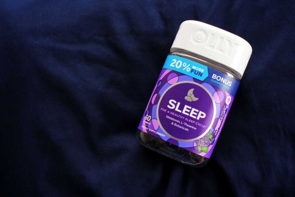 Olly Sleep gummies resting on a pillow - Olly melatonin class action