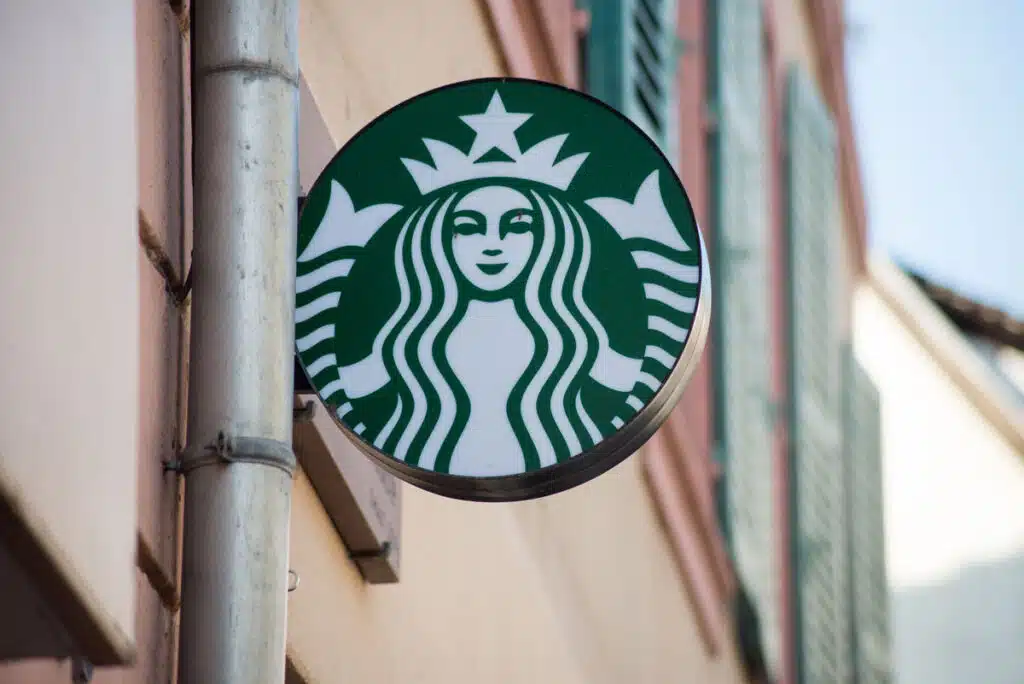 Closeup of Starbucks logo on signboard on store front - Starbucks Sprouted Grain bagel class action