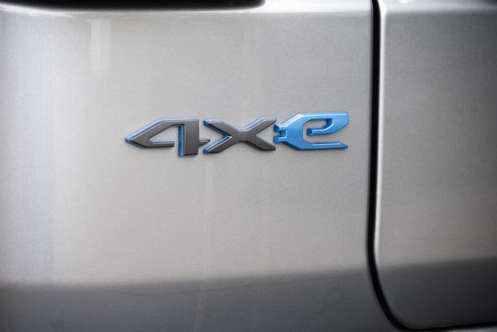 Close up of 4XE emblem on exterior of vehicle - Jeep Wrangler 4xe defect class action
