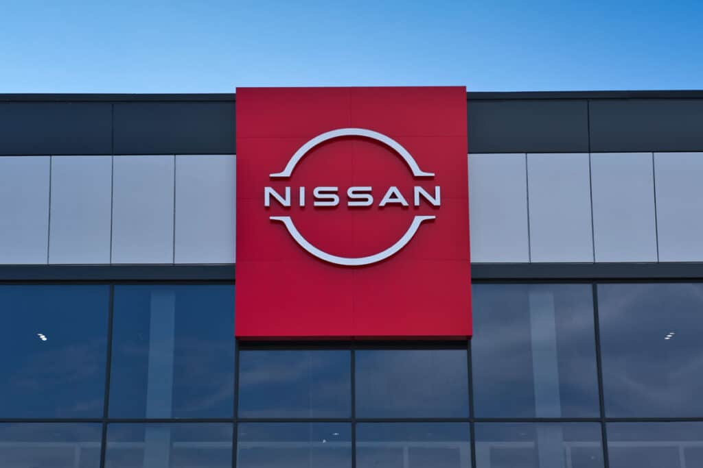 Close up of Nissan signage on the side of a building.