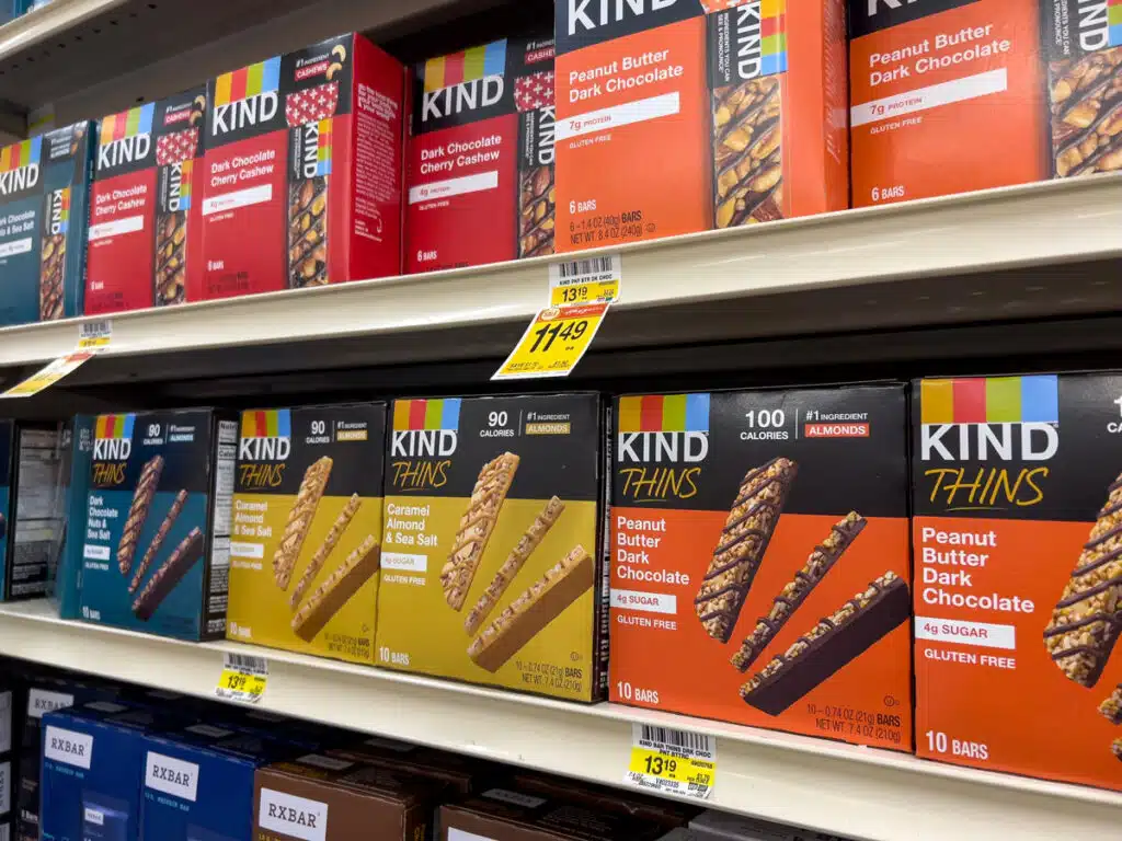 Close up, selective focus on Kind brand snack bars for sale inside a grocery store - Kind granola class action
