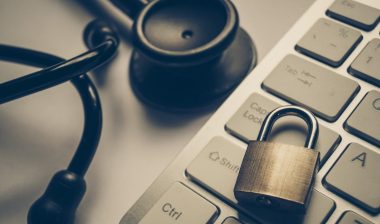Stethoscope, laptop, and lock, representing the San Andreas Regional Center data breach settlement.