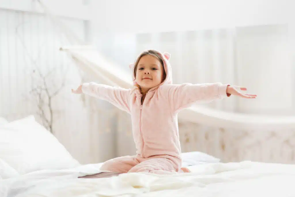 Little Girl in Pajamas waking up