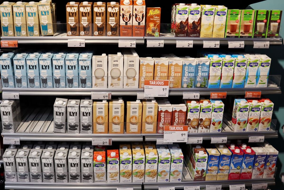 Plant-based milk cartons on grocery store shelf, representing the FDA milk proposal.