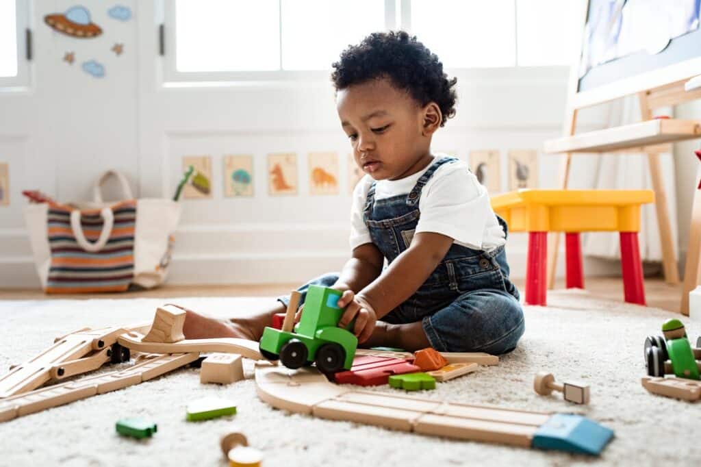 Cute baby playing with toys