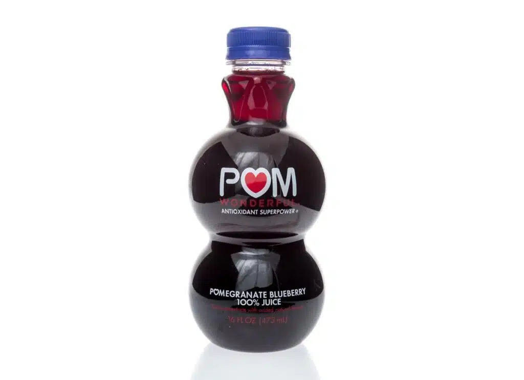 A bottle of Pom wonderful antioxident superpower pomegranate blueberry juice on an isolated background.