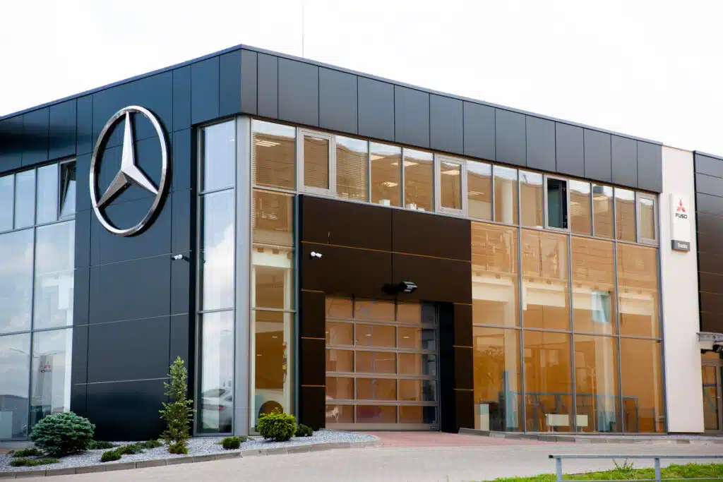The exterior of a Mercedes dealership, representing the Mercedes-Benz sunroofs class action lawsuit.