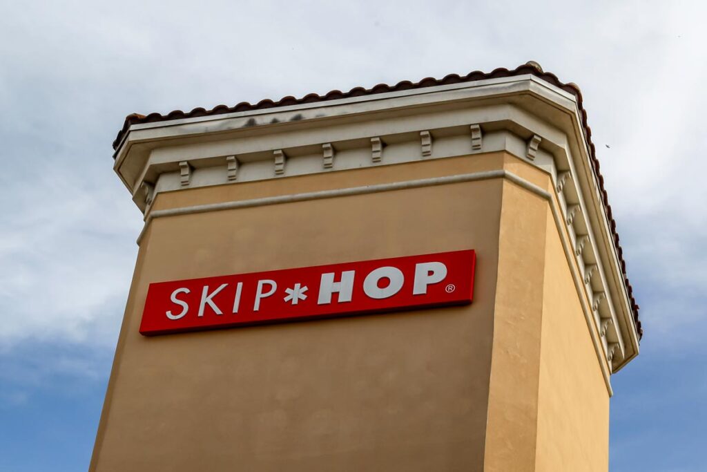 Close-up of Skip Hop signage, representing the activity gym recall