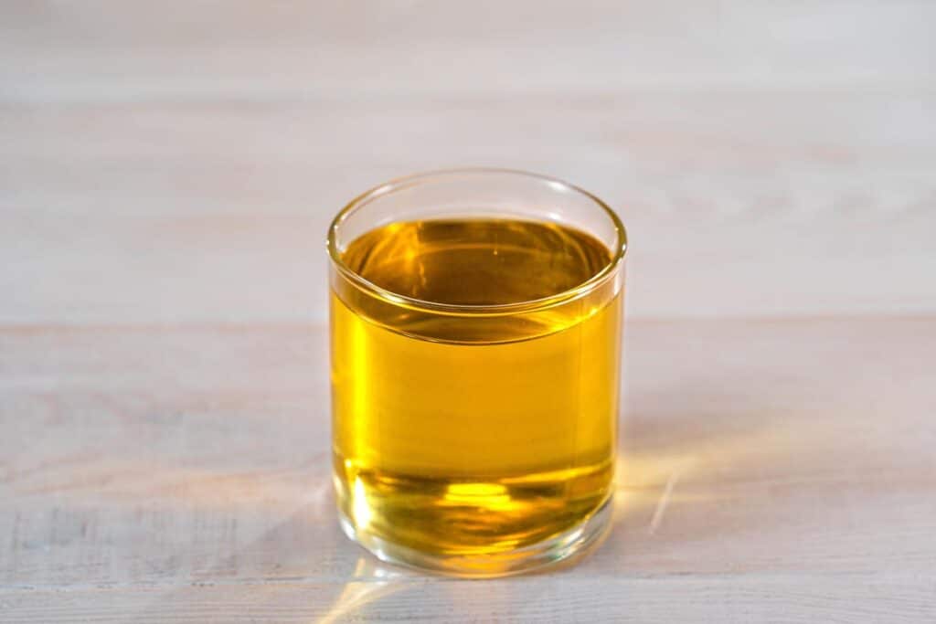Close up of freshly poured Apple Juice on a counter.