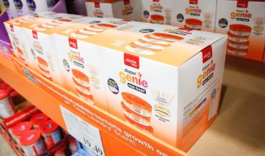 A view of several cases of Playtex Baby Genie Max Fresh refills on display at a local grocery store.