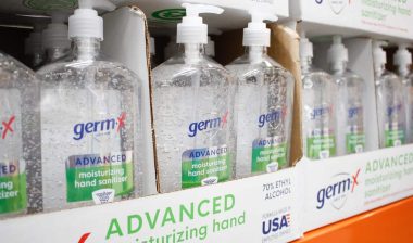 Close up of several containers of Germ X moisturizing hand sanitizer, on display at a local big box grocery store.