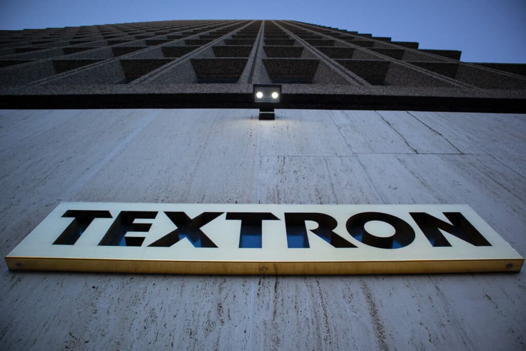 An upward view of the exterior of the Textron World Headquarters building, representing the PTV recall.