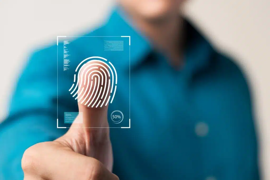 Close up of a man pushing his finger against the lens with a fingerprint overlay, representing the Ferndale Property Management settlement.