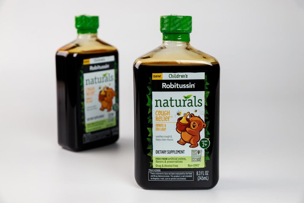 Close up of Robitussin bottles.