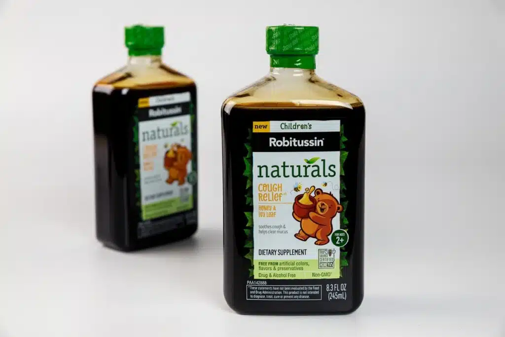 Close up of Robitussin bottles.