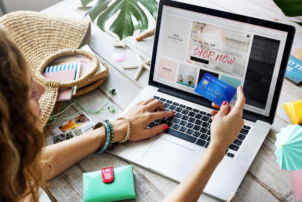 A girl using her laptop to shop online.