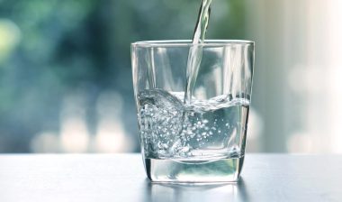 Close up of Water being poured into a glass, representing the Pluris Wedgefield class action settlement.