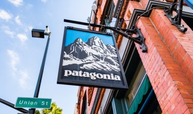Patagonia store sign hanging from brick building