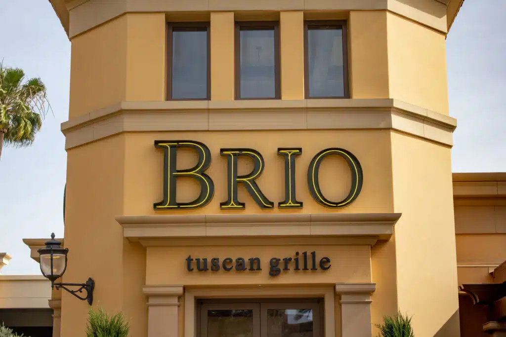 A store front sign for the Italian restaurant known as Brio Tuscan Grille