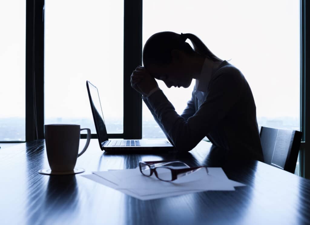 Stressed business woman, representing the Cameron Mutual Insurance settlement.