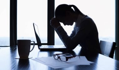 Stressed business woman, representing the Cameron Mutual Insurance settlement.