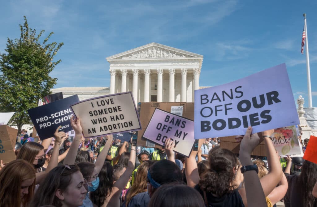 Person protesting the overturning of Roe v Wade