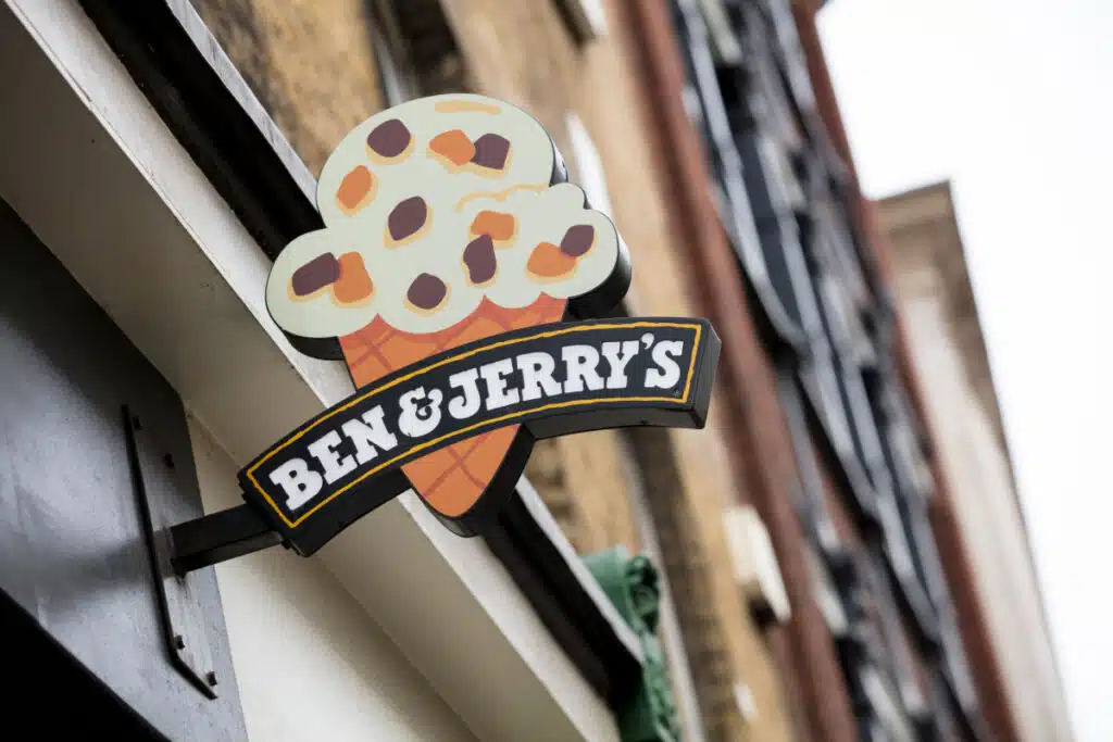 Ben and Jerry's store sign hanging from building
