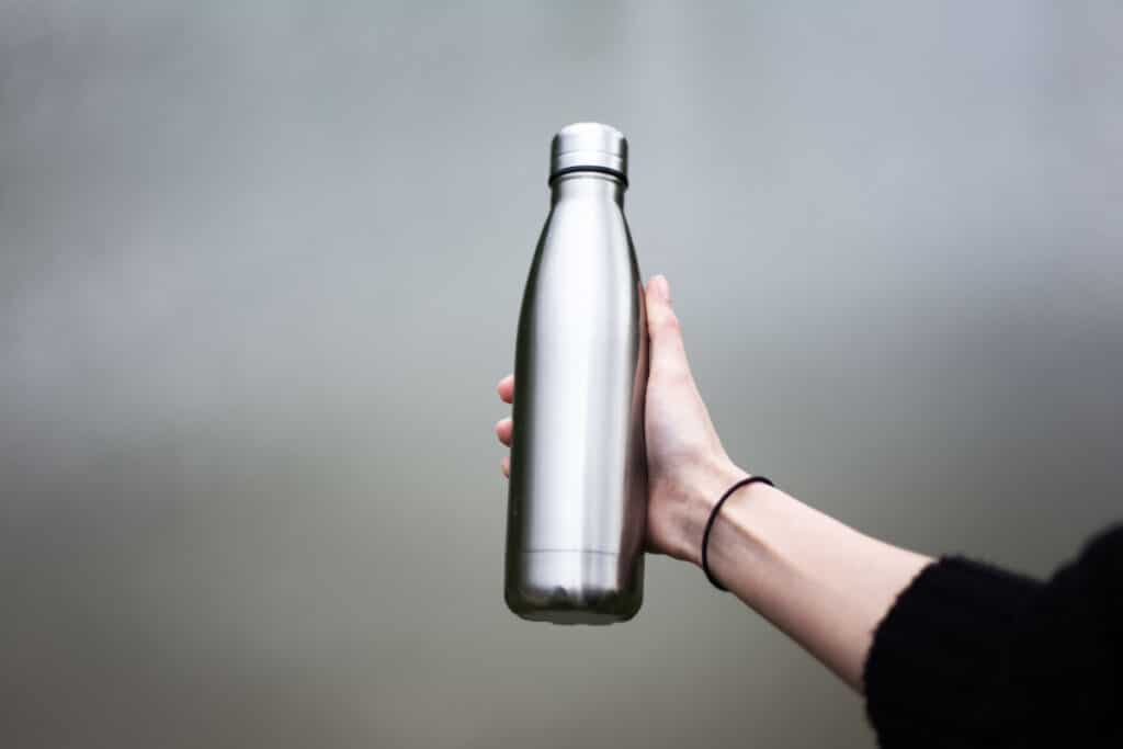 A person holding a metal water bottle, representing the Bindle bottles class action