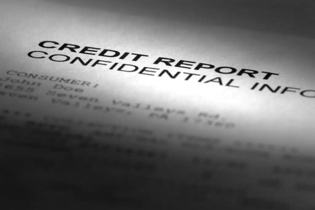 A paper that reads "Credit Report, Confidential",representing the Preferred Precision Group class action lawsuit settlement.