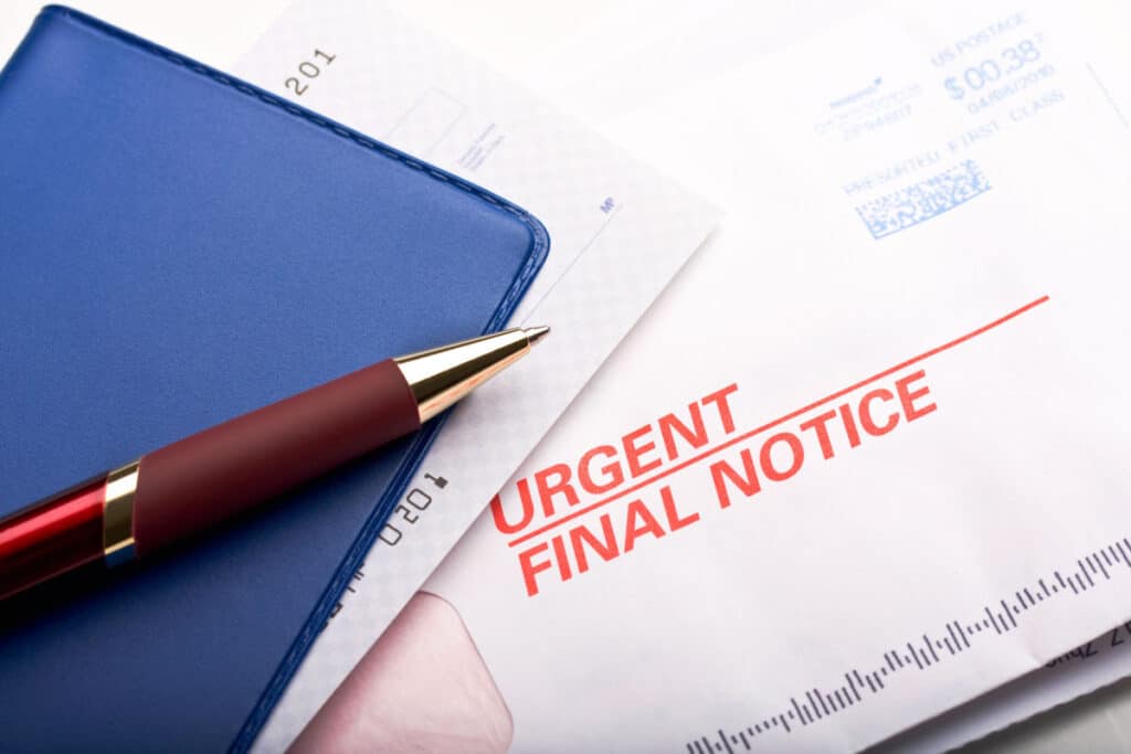 A checkbook and a final notice bill, representing the Transworld debt-collection calls class action settlement.
