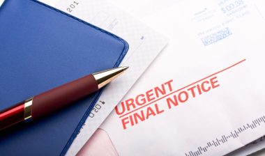 A checkbook and a final notice bill, representing the Transworld debt-collecction calls settlement.