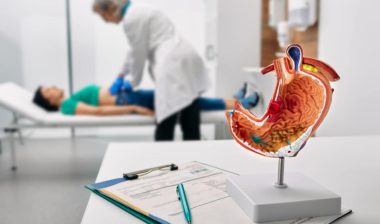 A doctor examining a patient, representing the Illinois Gastroenterology Group settlement.
