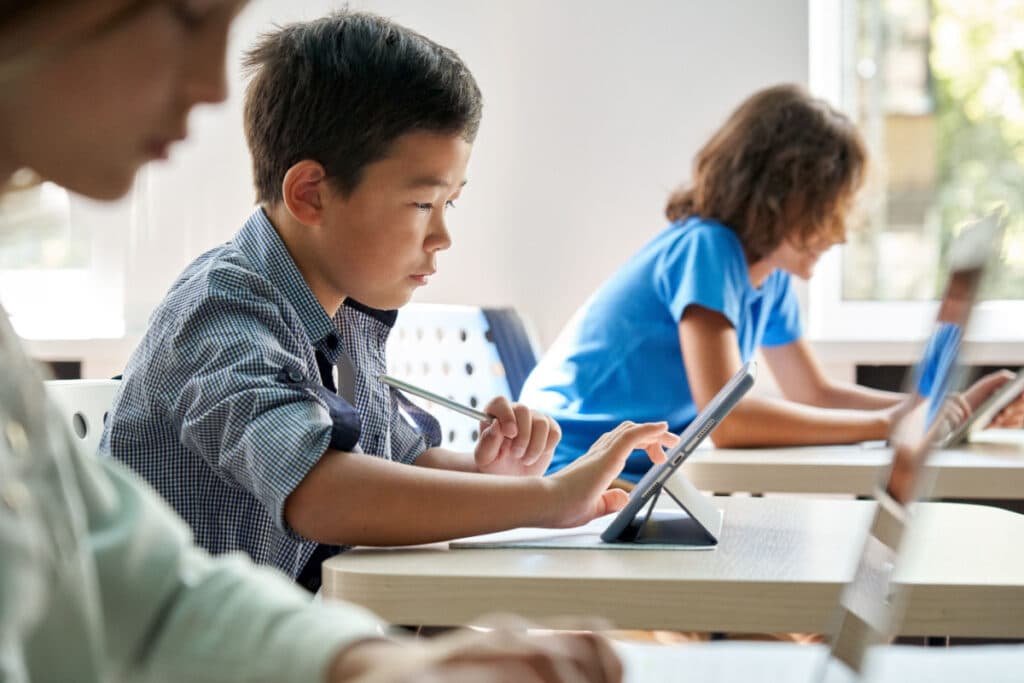 Children learning on laptops