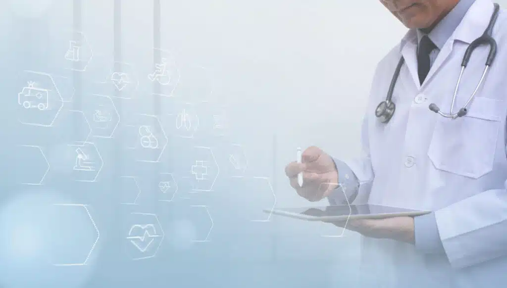 A doctor writing on a tablet