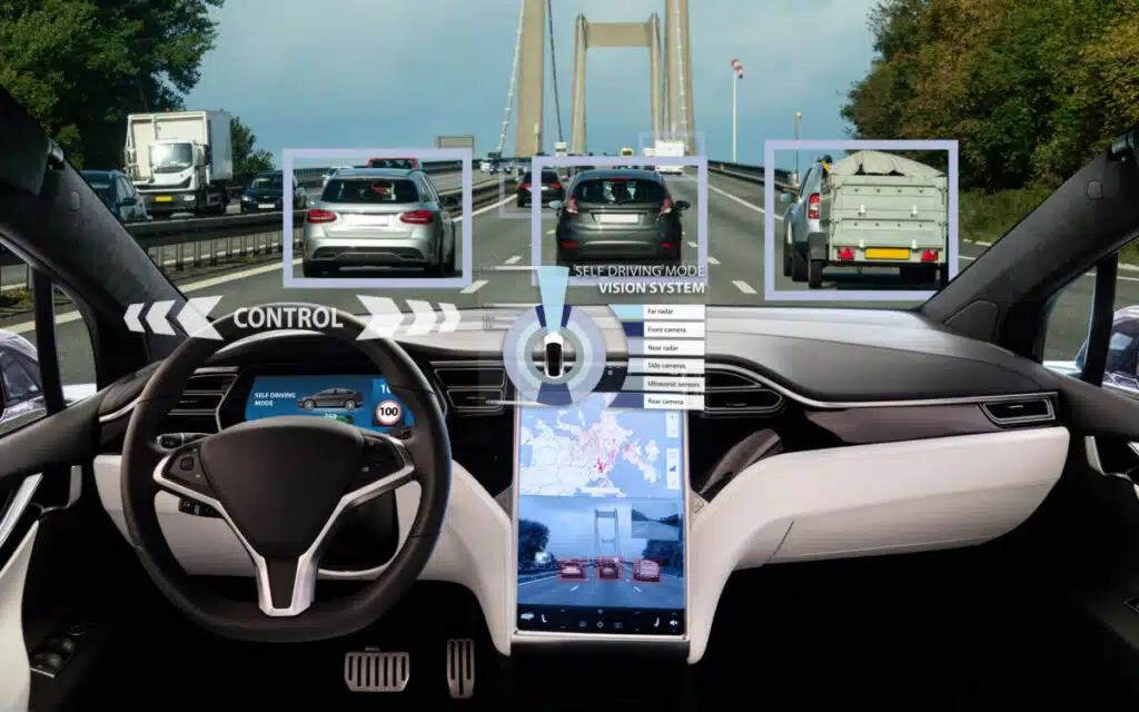 Inside of a Tesla displaying self driving feature