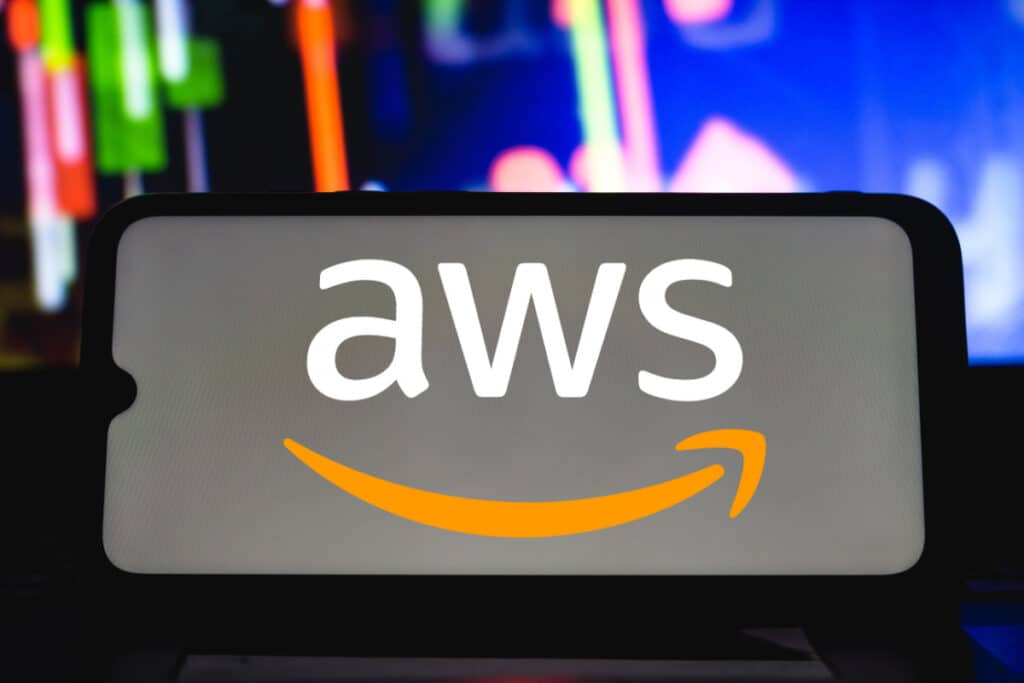 The AWS logo is seen on the screen of a smartphone, representing the Amazon NBA 2K facial scans class action